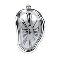 Silver melting clock, polished chrome enamel rim with a white dial and printed Roman numerals